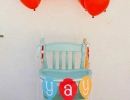 Bright and happy balloon high chair | 10 1st Birthday Party Ideas for Boys Part 2 - Tinyme Blog