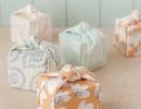 Oh-so-sweet knotted fabric-wrapped favor boxes | 10 Cute and Creative Gift Wrapping ideas - Tinyme Blog